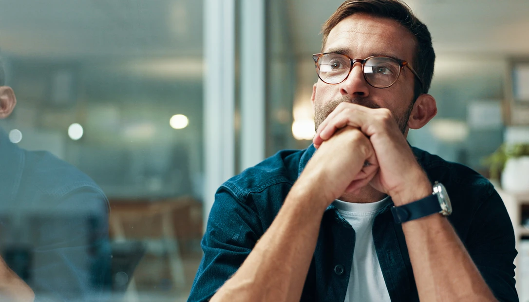 A solitary figure gazes at a wall of closed books, symbolizing the end of questioning in the age of certainty.
