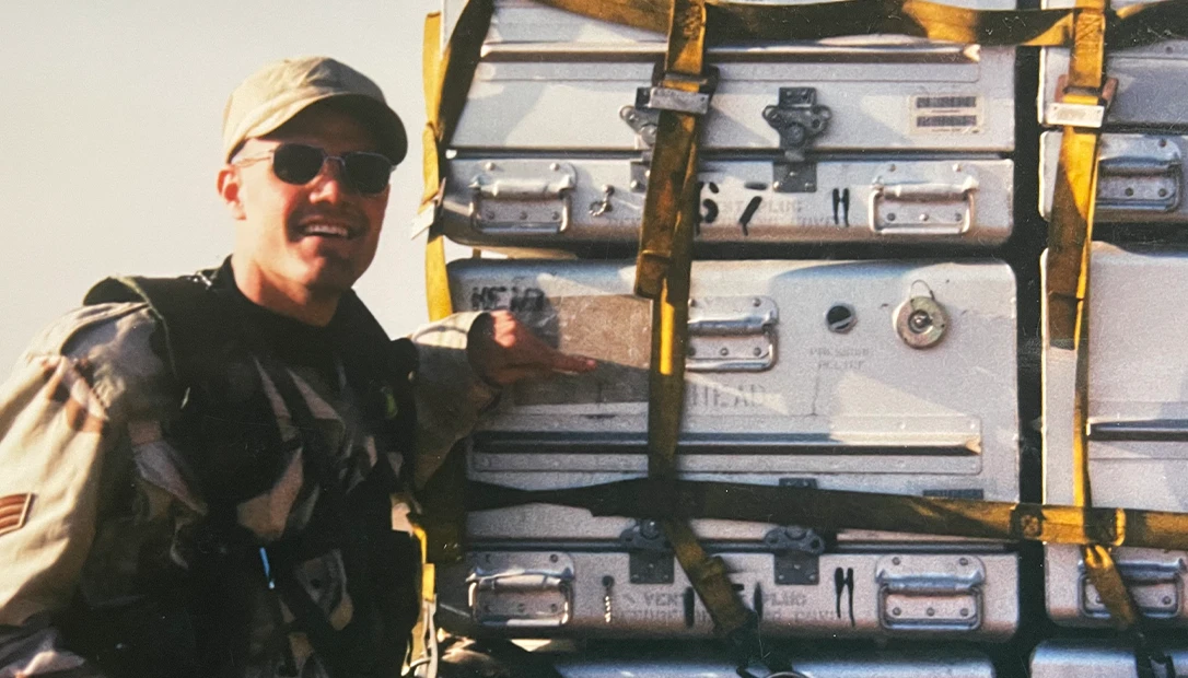 Morgan stands posed next to the gear.