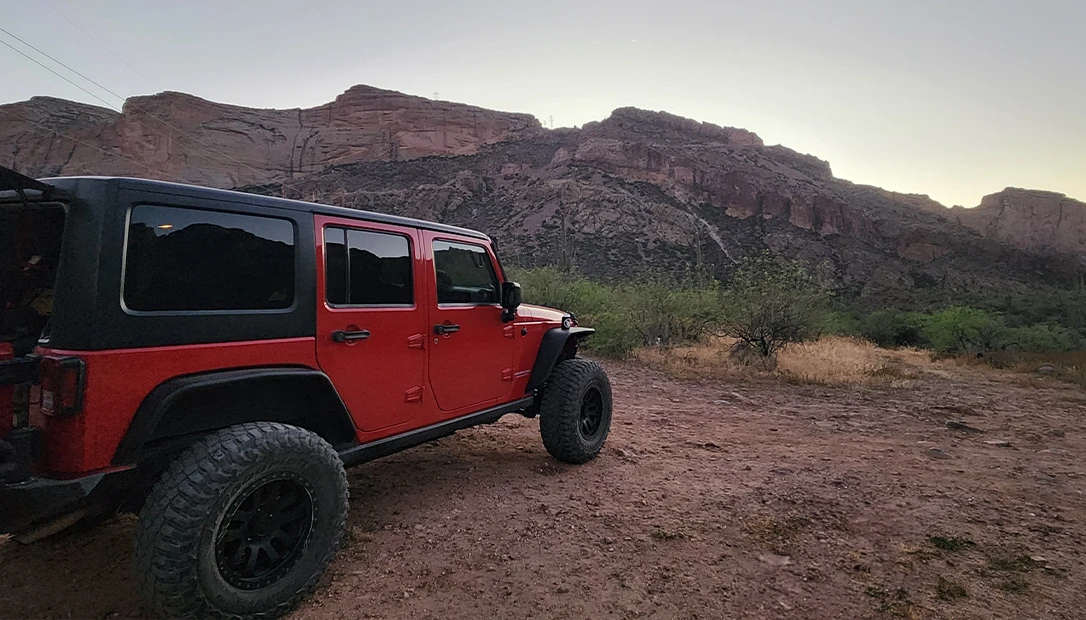 A 2011 Used Jeep wrangler sits ready for an outdoor adventure.