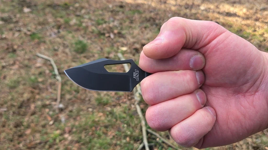 An easily grabbed fixed blade that you could snatch with gross motor skills proved to get into the fight much faster.