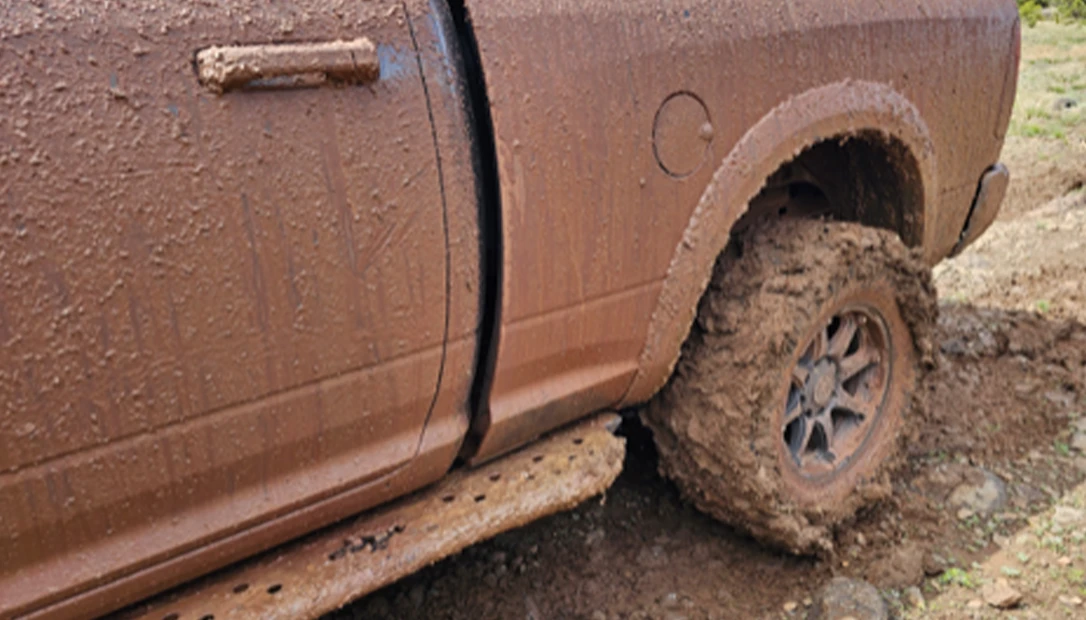 Red clay and runoff packed into the tires during the climb toward the rim.