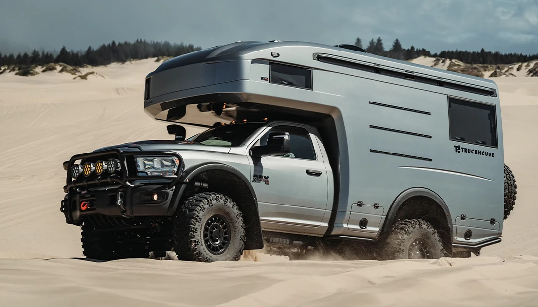 A big silver off-road rig.
