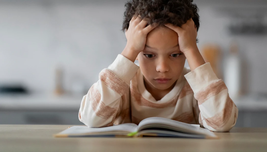 Child sitting witha book