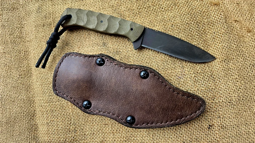 An example of a Kydex sheath with leather lining on the outside; a Winkler Knives Mentor in SERE Configuration.