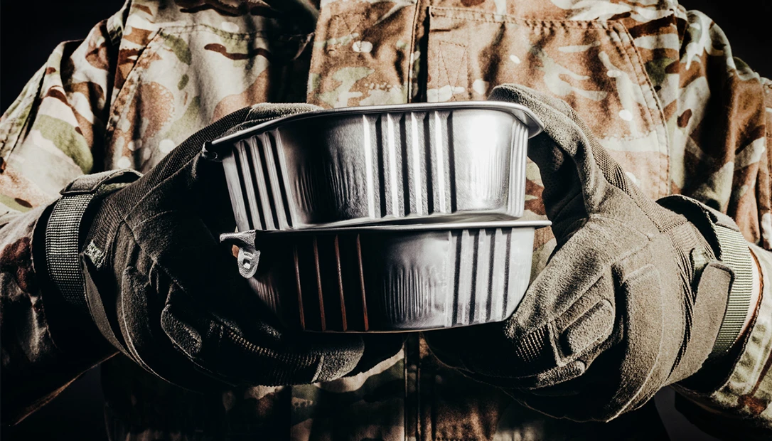 A soldier holding chow