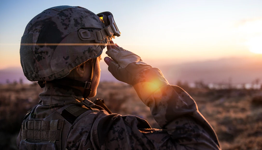 Mature military candidate saluting