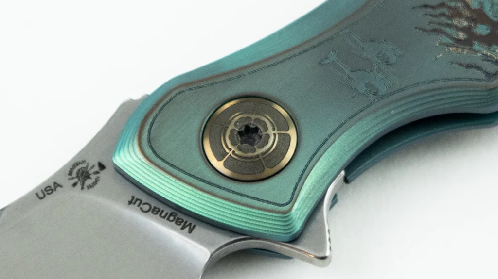 The bronze anodized pivot on the Spartan-Ronin Five Rings Project—FIRE rounds out the theme with an engraving of a Japanese floral pattern, reminiscent of the Oda clan mon.