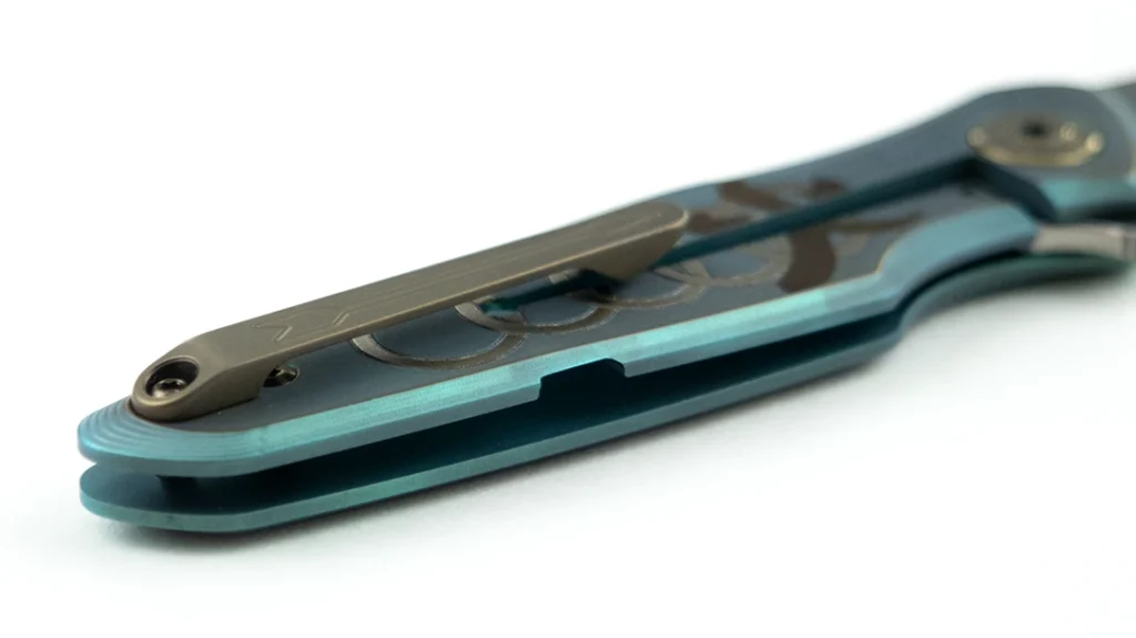 The monolithic titanium pocket clip, with familiar Spartan arrow, features a bronze anodized finish.