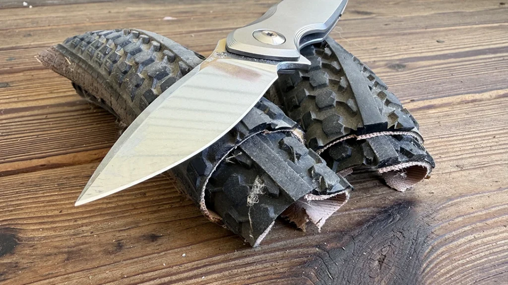 The author cut a length of tire in half, then I stacked the two halves and bisected both pieces.