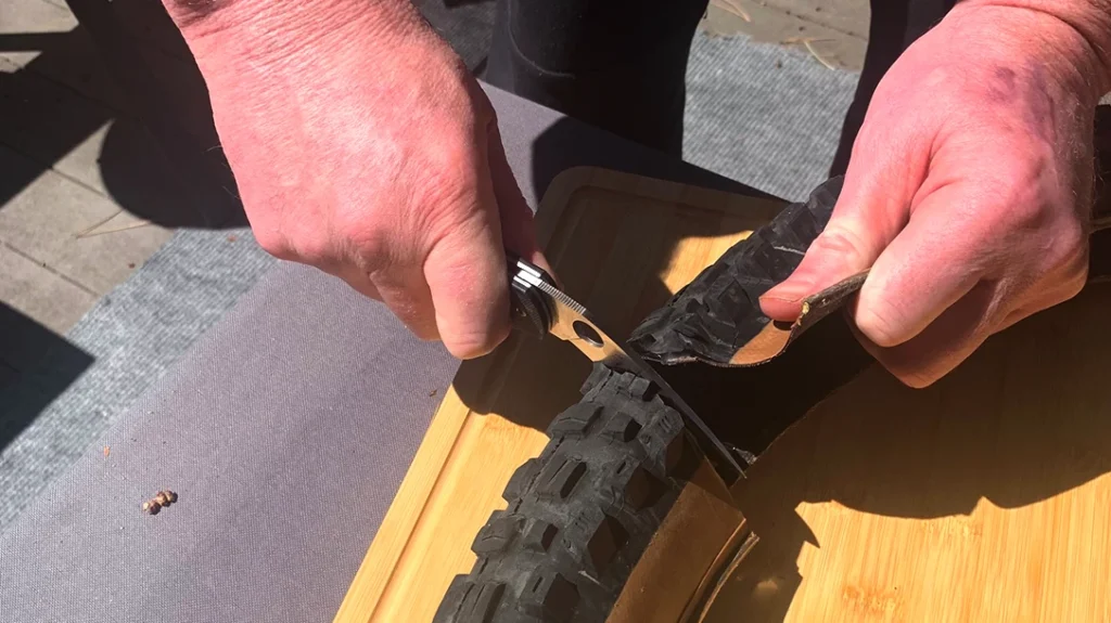 The author tested the knife’s true cutting mettle by seeing how it would slice through a mountain bike tire.