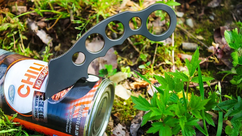 From the side, the High Desert Blade Works Tarani AR15 Karambit easily punched through the aluminum can.