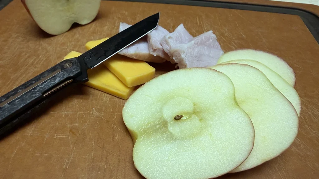 Although the tanto profile is not ideal for slicing food, the thin blade stock and keen edge made up for it.