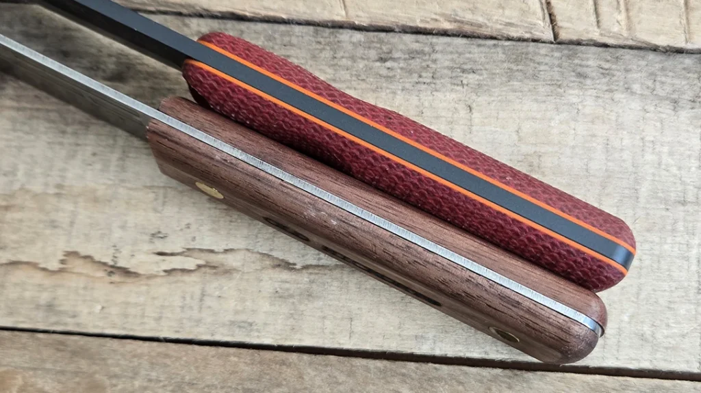 TOPS adds a set of orange G10 liners to the Ontario XL Hunter, giving them a pop of color.