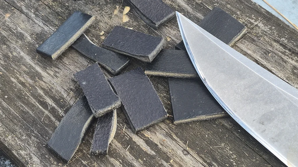 A leather belt posed no trouble for the keen edge of the blade.