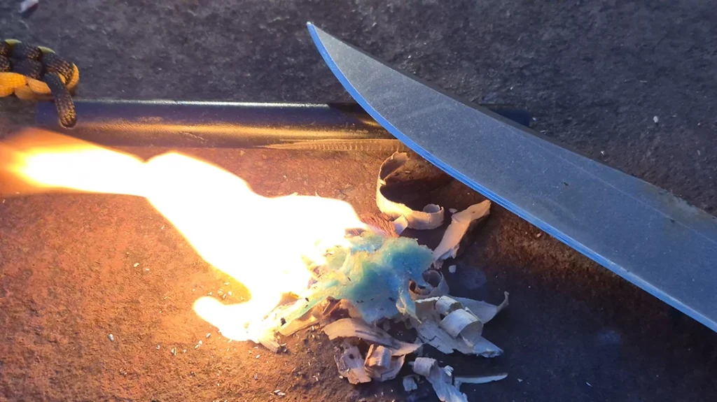 The spine on the blade is sharp enough to scrape sparks from a ferro rod and start a fire.