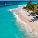 Colorful waterfront and lush tropical landscape in Guadeloupe, a hidden Caribbean island destination.