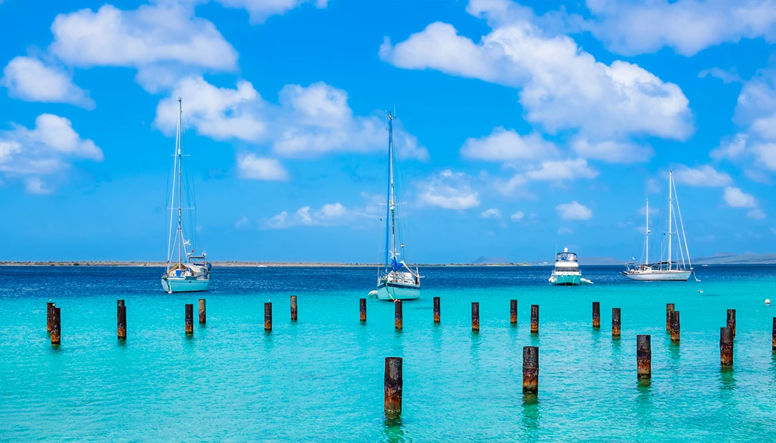 Crystal-clear turquoise waters and rocky coastline on the island of Bonaire in the Caribbean.