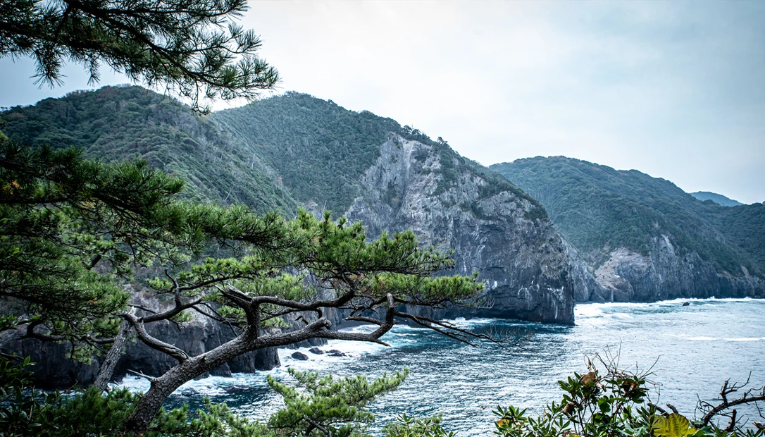 Dramatic ocean scene depicting the Dragon’s Triangle with towering waves.