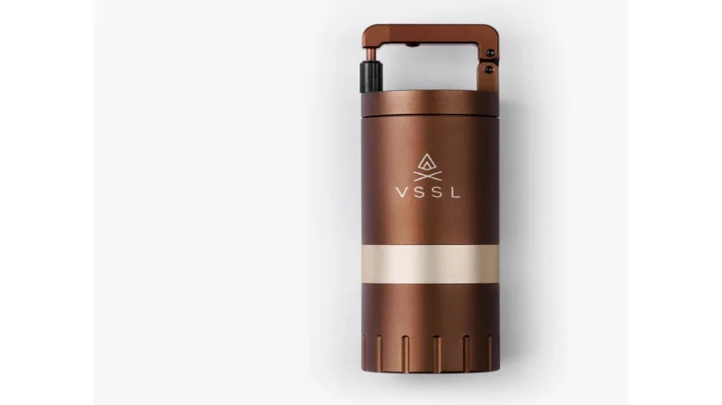 Close-up of the VSSL Coffee Grinder showing its precision stainless steel conical burrs and adjustable grind settings