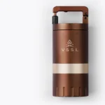 Close-up of the VSSL Coffee Grinder showing its precision stainless steel conical burrs and adjustable grind settings