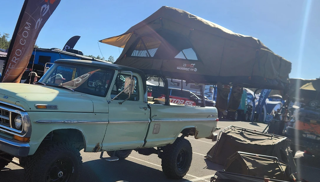 Roof top tent on a vintage ford truck.