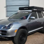 modern day hard shell RTT on a porsche suv.