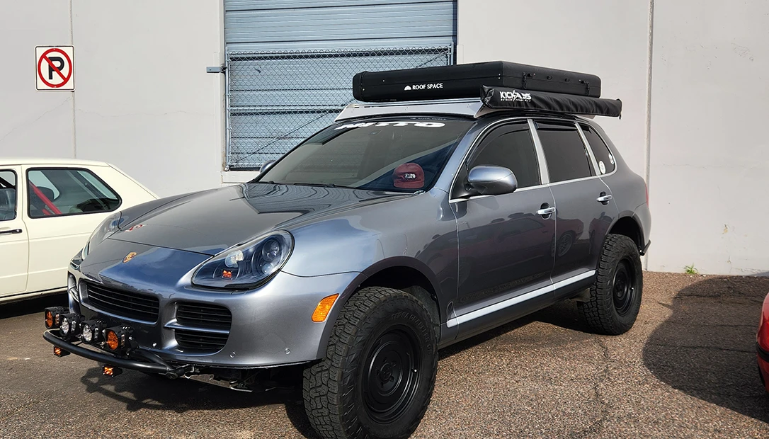 modern day hard shell RTT on a porsche suv.