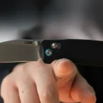 Knife balancing on a finger.