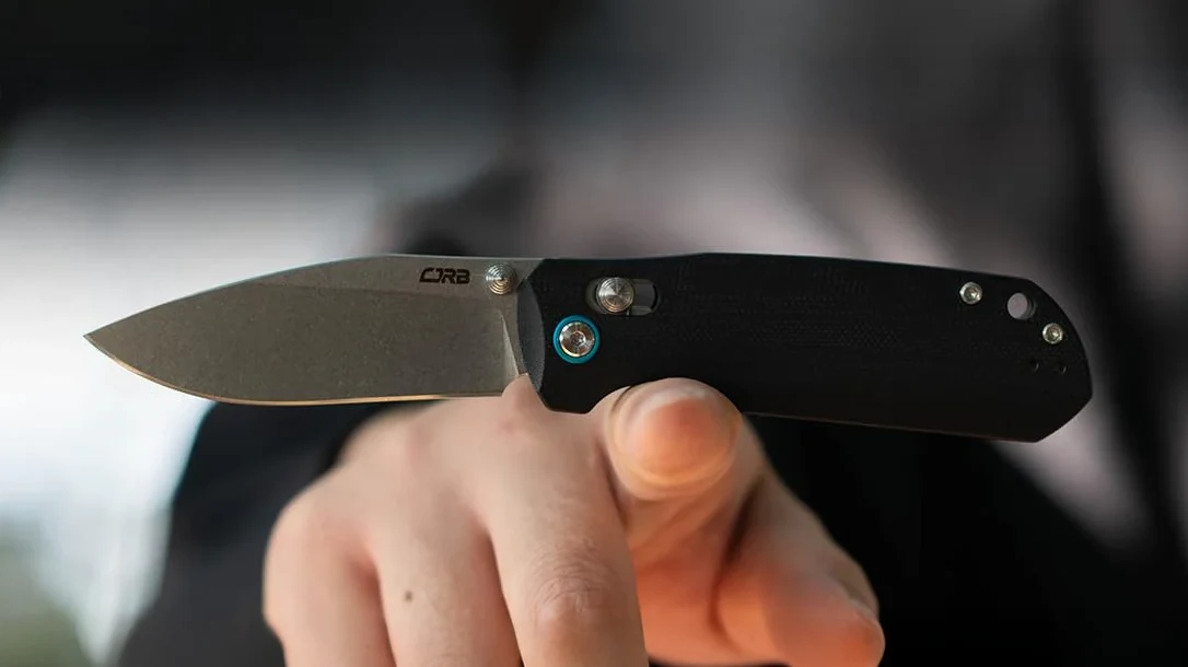 Knife balancing on a finger.