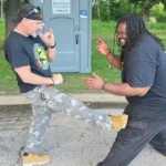 kick him in the leg