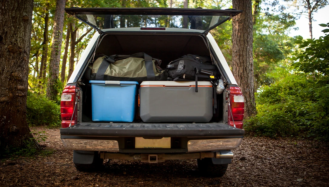 Hard-sided cooler loaded for a weekend camping adventure